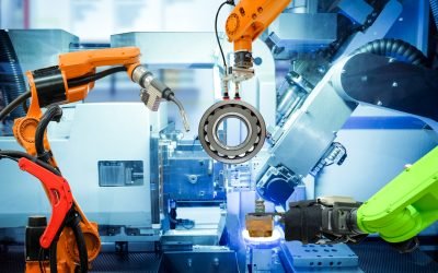 Industrial robotic welding and robot gripping working on smart factory, industry 4.0 and technology concept Industrial robotic welding and robot gripping working on smart factory, on machine blue tone color background, industry 4.0 and technology.